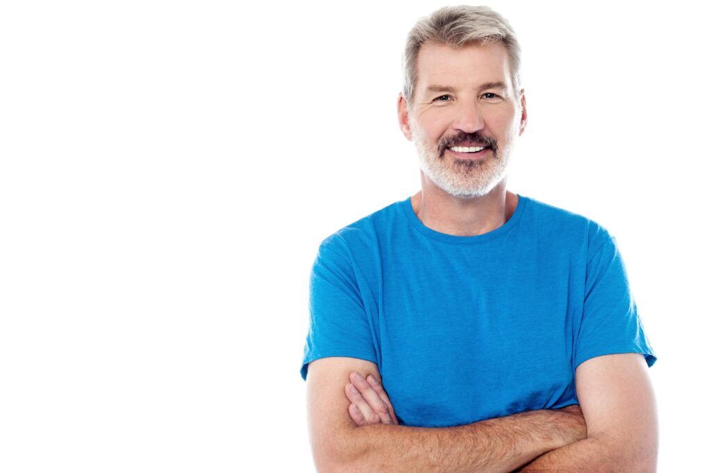 man wearing blue shirt and smiling