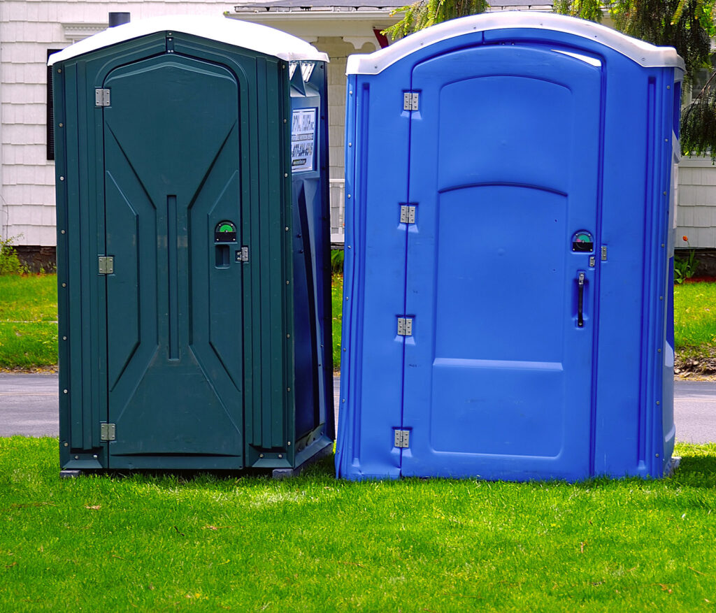 a green and blue portable toilet